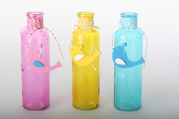 Okrugle staklene flaše sa ptičicama u boji